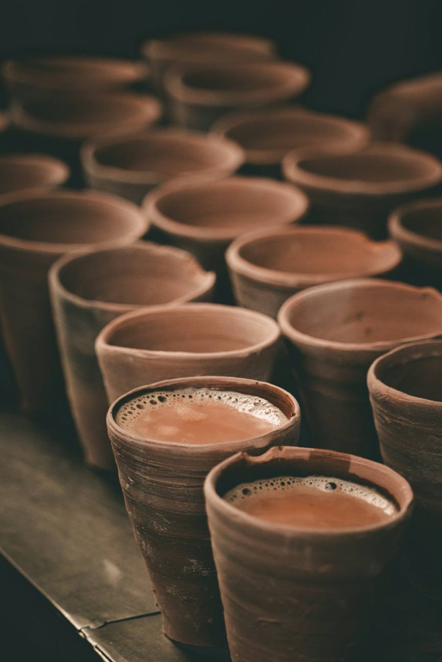Stacked clay cups filled with hot tea
